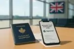 Паспорт Канады и смартфон с экраном Electronic Travel Authorization (ETA) на фоне светлого аэропорта